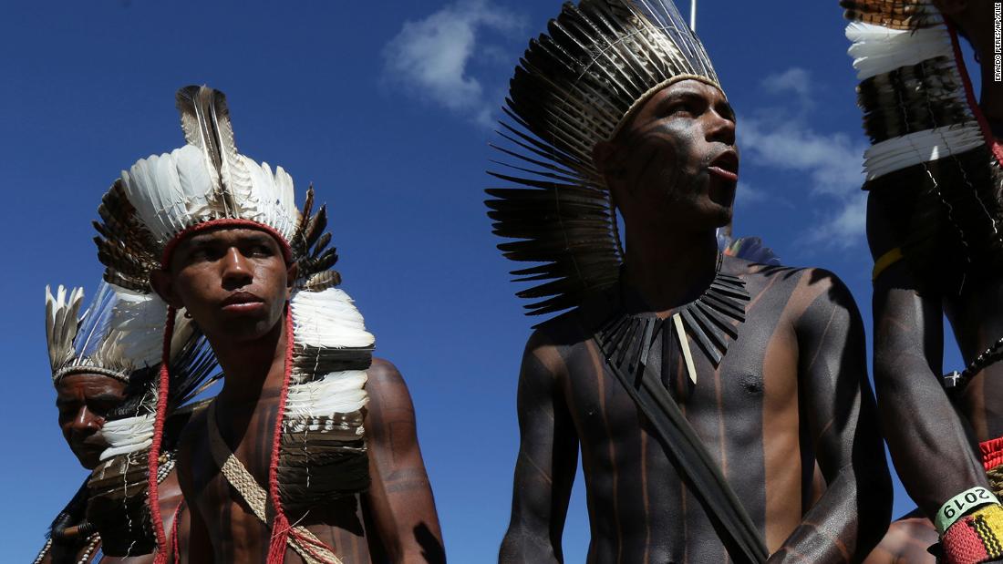 In this photo from April of 2019, Xavante people carry their traditional weapons during the annual three-day protest known as The Free Land Encampment.