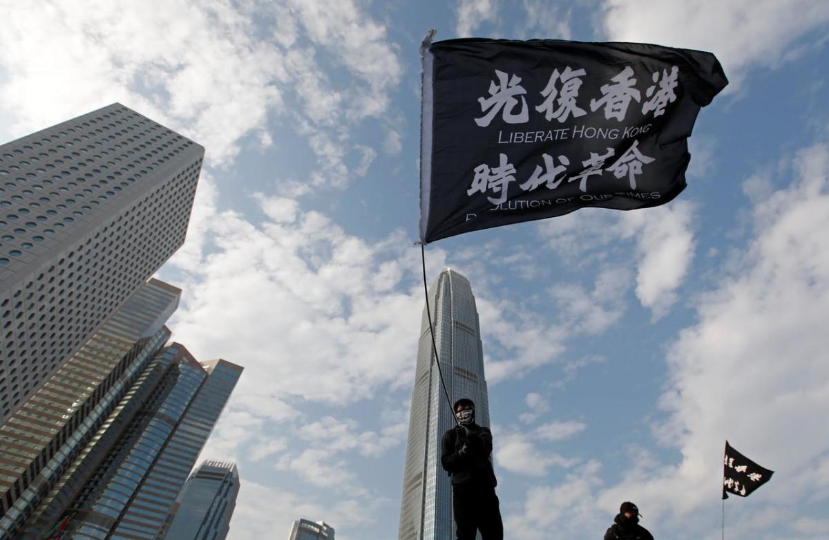 An anti-government protester waves a flag during a protest at Edinburgh Place in Hong Kong, China, January 12, 2020. REUTERS/Navesh Chitrakar/Files