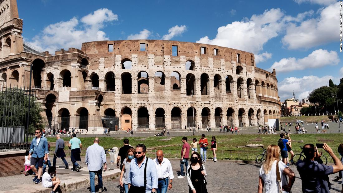 Groups of tourists in front of the Rome's Colosseum on June 14.