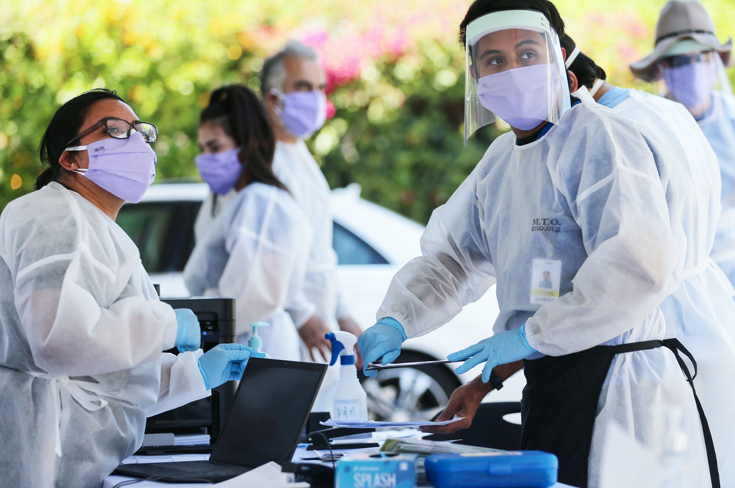 Healthcare workers facilitate Covid-19 tests on August 11 in Los Angeles, California.